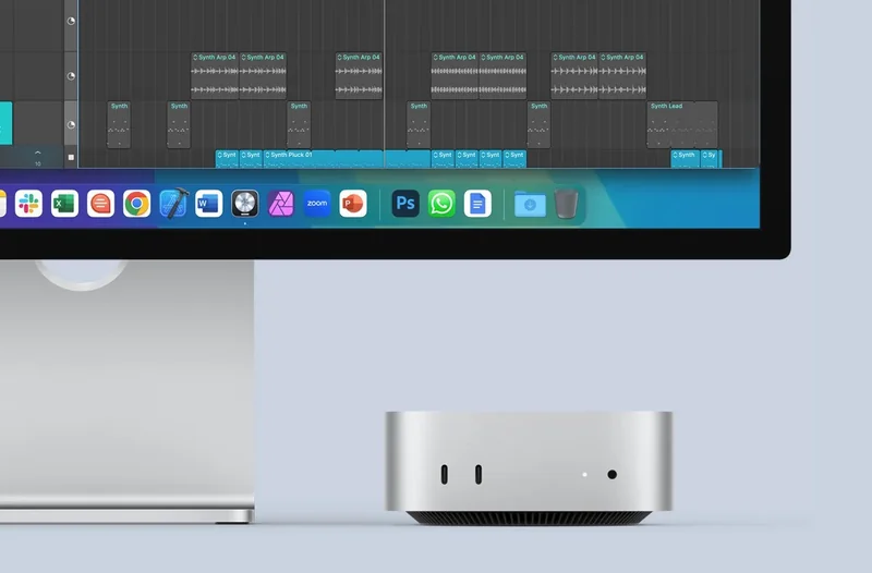新 Mac mini 与 Studio Display 组成的桌面场景官方渲染图