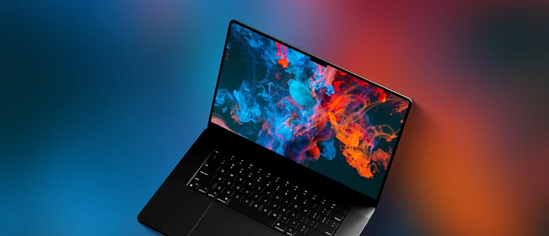 MacBook Pro 概念渲染图：深色机身斜角俯视，键盘与屏幕清晰可见，屏幕显示红蓝色烟雾状画面，顶部无刘海